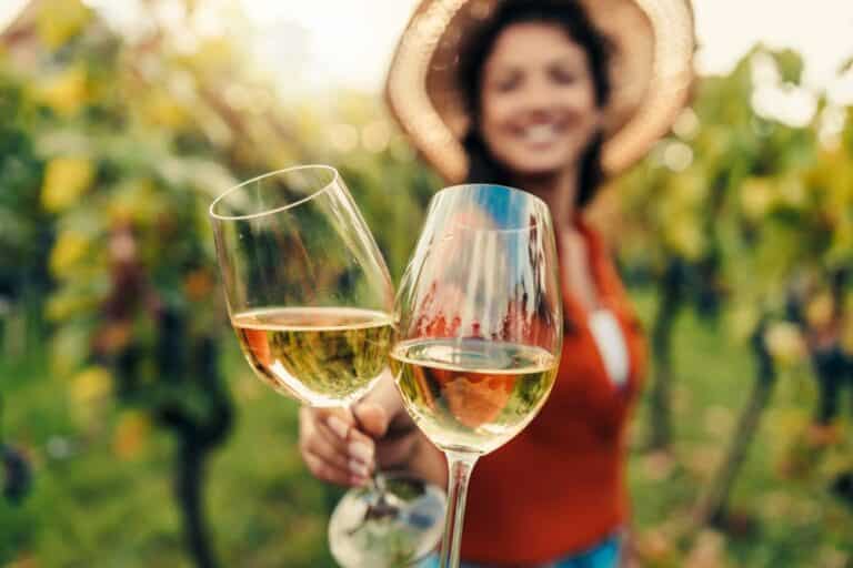 Hood River Wineries, woman tasting wine in a vineyard